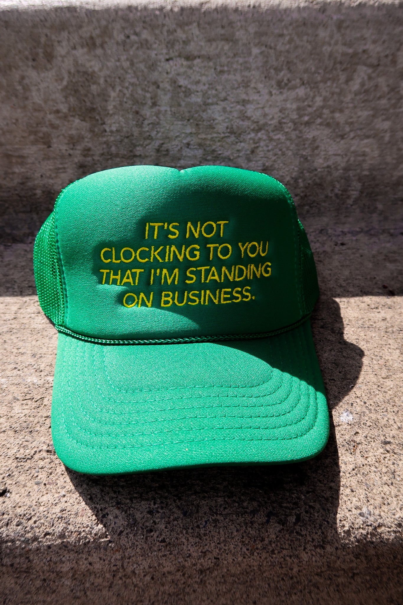 It's Not Clocking Embroidered Green Trucker Hat
