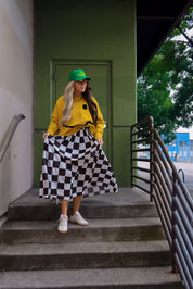 **PRE-ORDER: ships by 9/15** Victory Lap Checkered Maxi Pleated Skirt